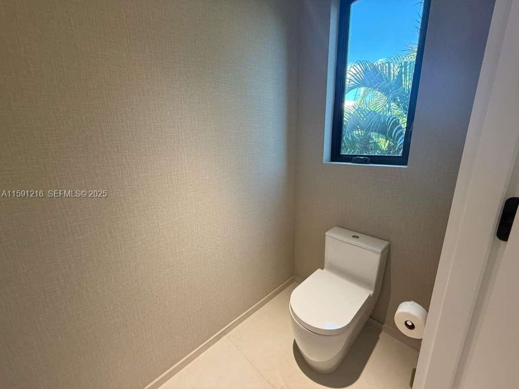 135 Southwest 29th Road Miami, FL 33129 - Photo 48 of 69 a white toilet sitting next to a shower