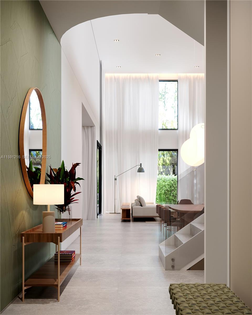 135 Southwest 29th Road Miami, FL 33129 - Photo 5 of 69 a living room with furniture a window and a potted plant