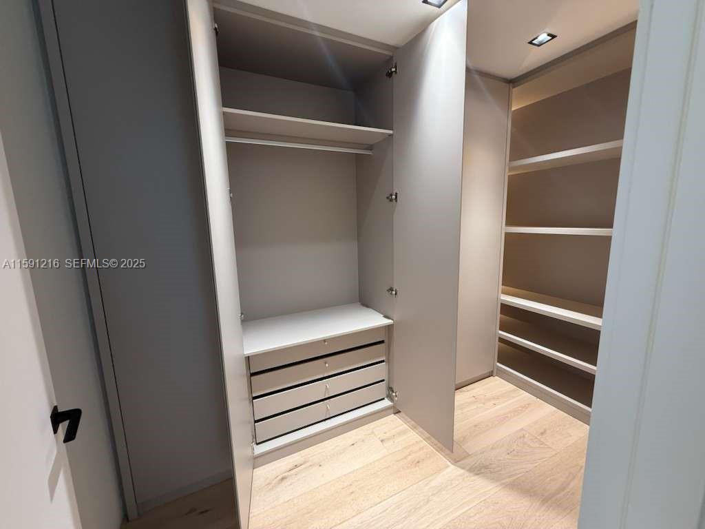 135 Southwest 29th Road Miami, FL 33129 - Photo 55 of 69 a view of bedroom with a closet and wooden floor