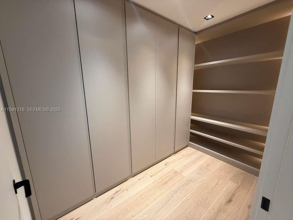 135 Southwest 29th Road Miami, FL 33129 - Photo 56 of 69 a view of walk in closet with empty racks