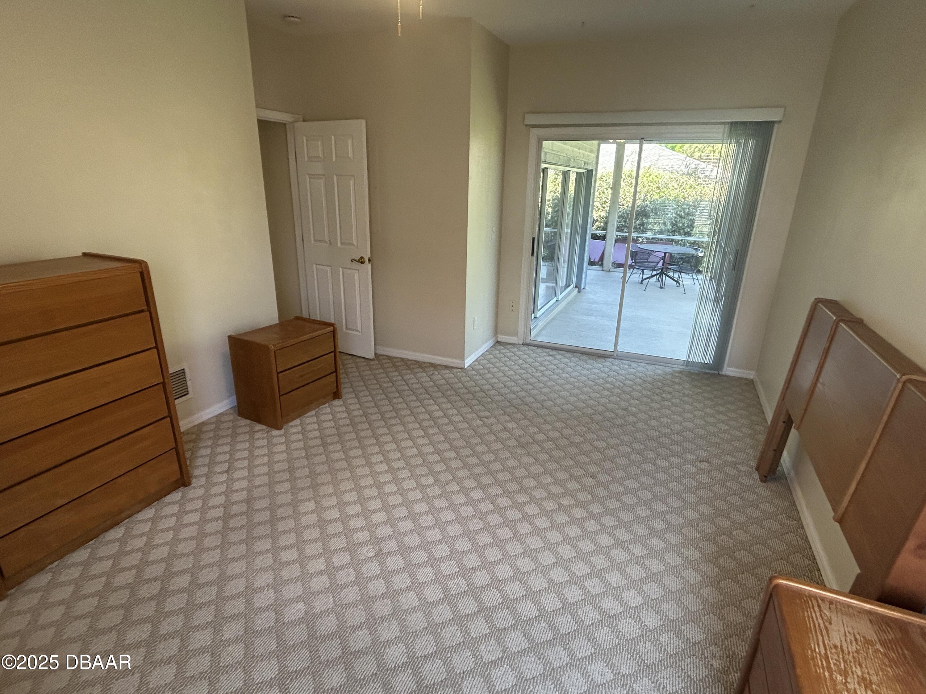 38 Magnolia Drive South, Unit S Ormond Beach, FL 32174 - Photo 5 of 12 a view of room with window and wooden floor