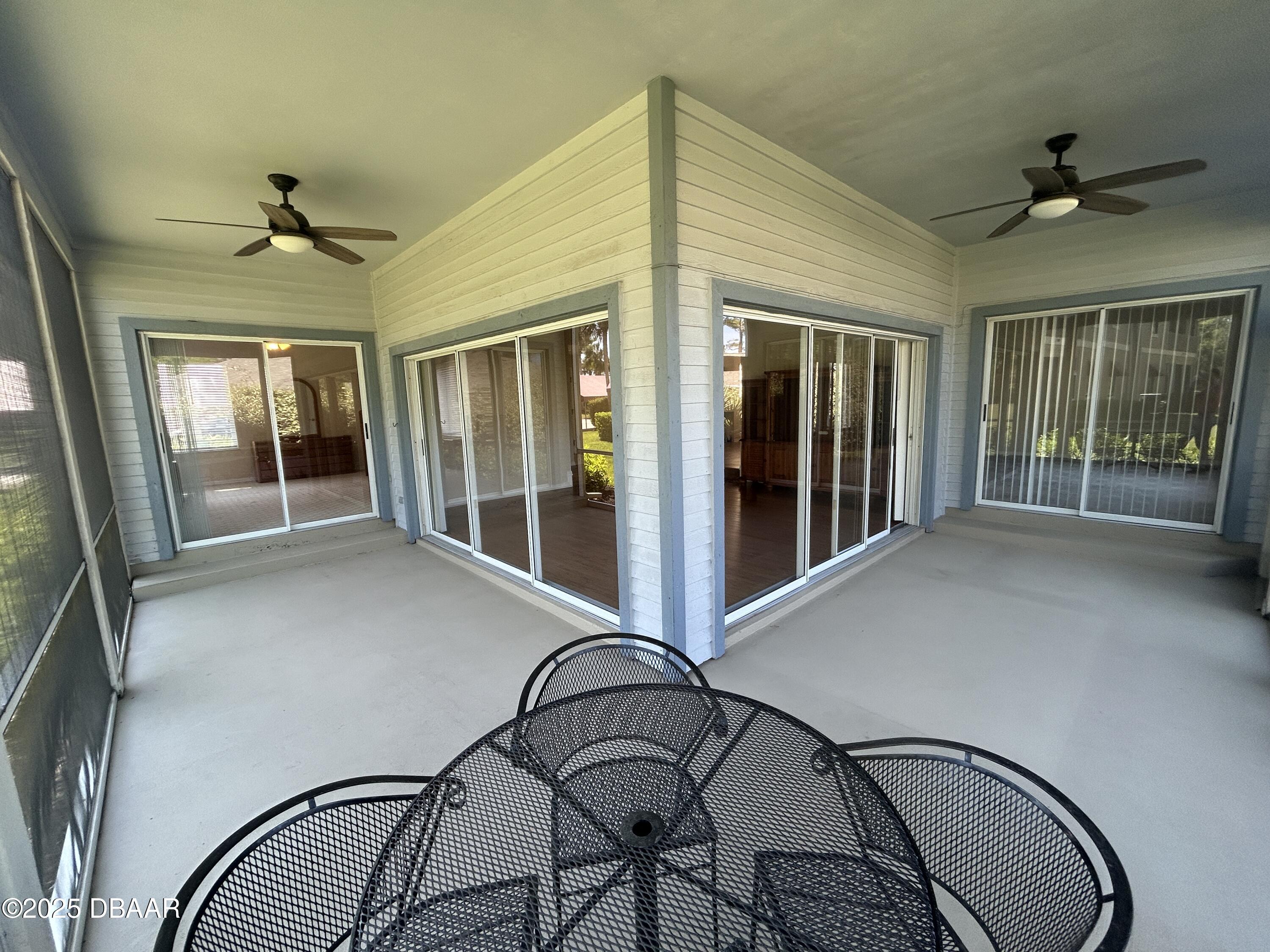 38 Magnolia Drive South, Unit S Ormond Beach, FL 32174 - Photo 8 of 12 a view of a livingroom with furniture window and a floor to ceiling window