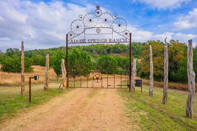 a view of a swimming pool with a bench in patio