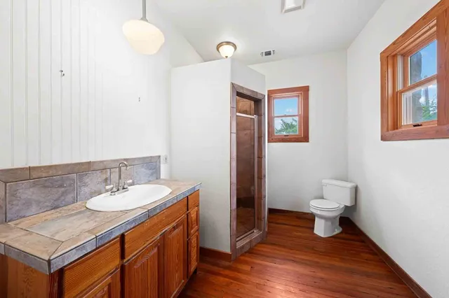 an entryway of a house with wooden floor