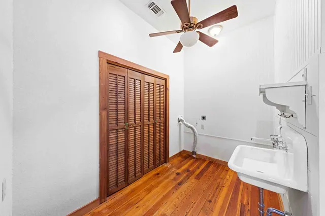 a bathroom with a toilet a sink and shower