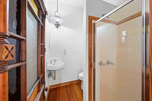 a view of an empty room with windows