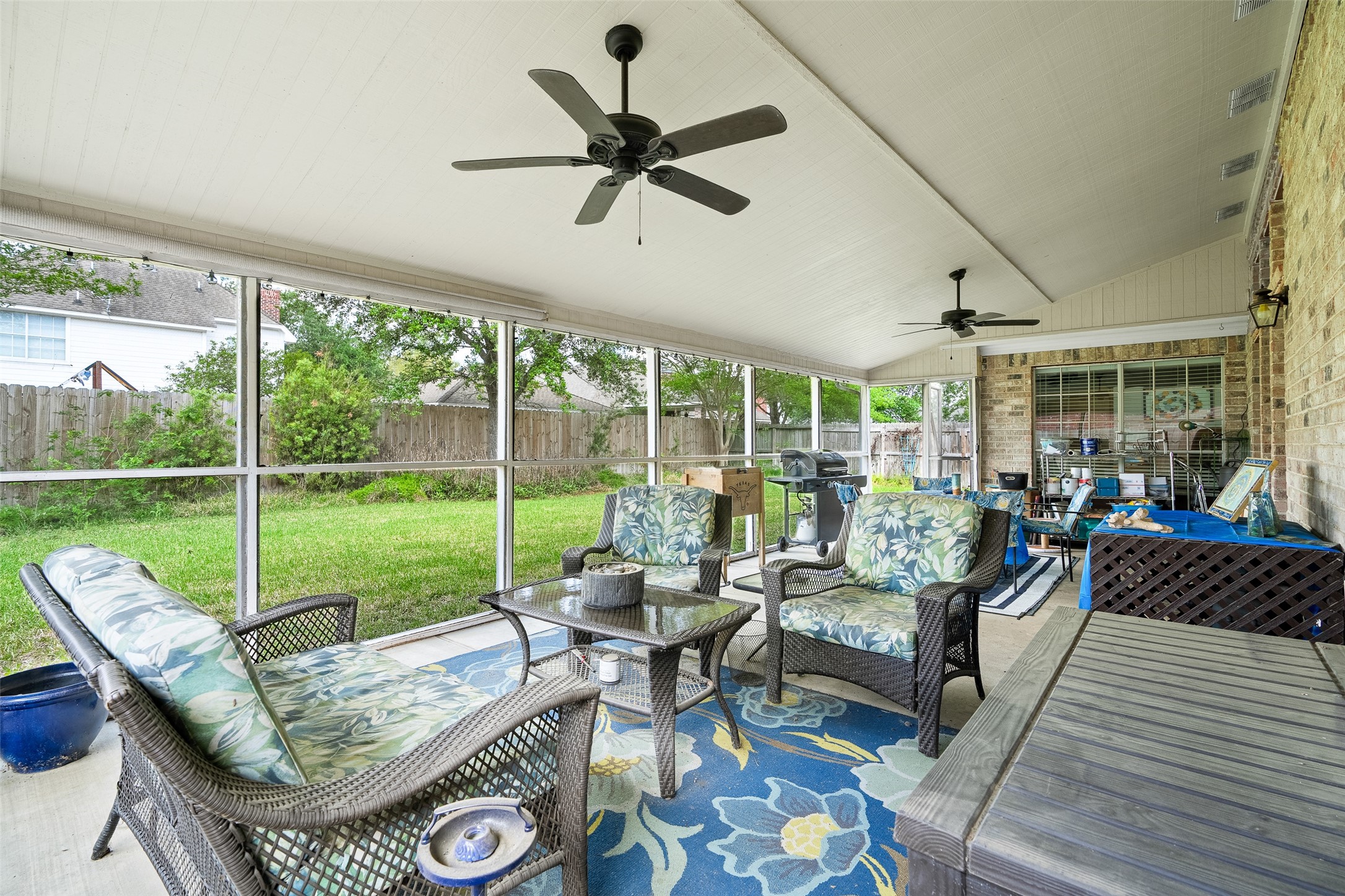 21719 Long Castle Drive Spring, TX 77388 - Photo 14 of 19 Don’t miss the spacious screened patio, perfect for outdoor cooking, entertaining, and enjoying the open-air lifestyle!