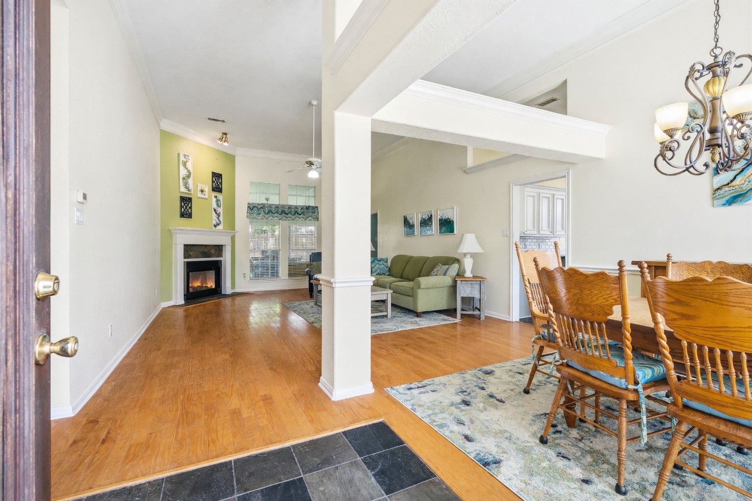 21719 Long Castle Drive Spring, TX 77388 - Photo 2 of 19 Step into your beautiful home and be welcomed by a spacious entryway that gracefully leads into the heart of the home and the dining room to your right.