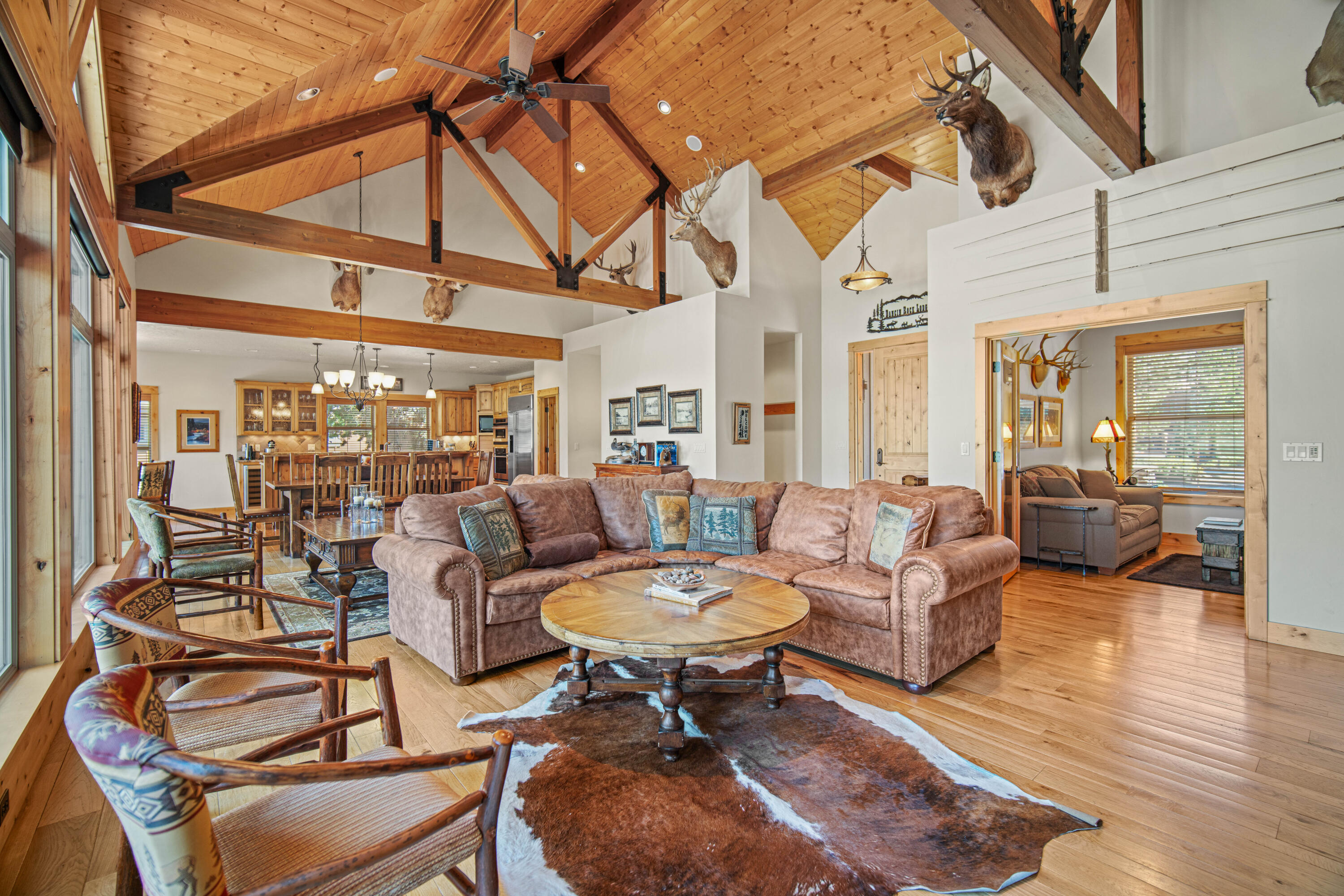 a living room with furniture a table and chairs