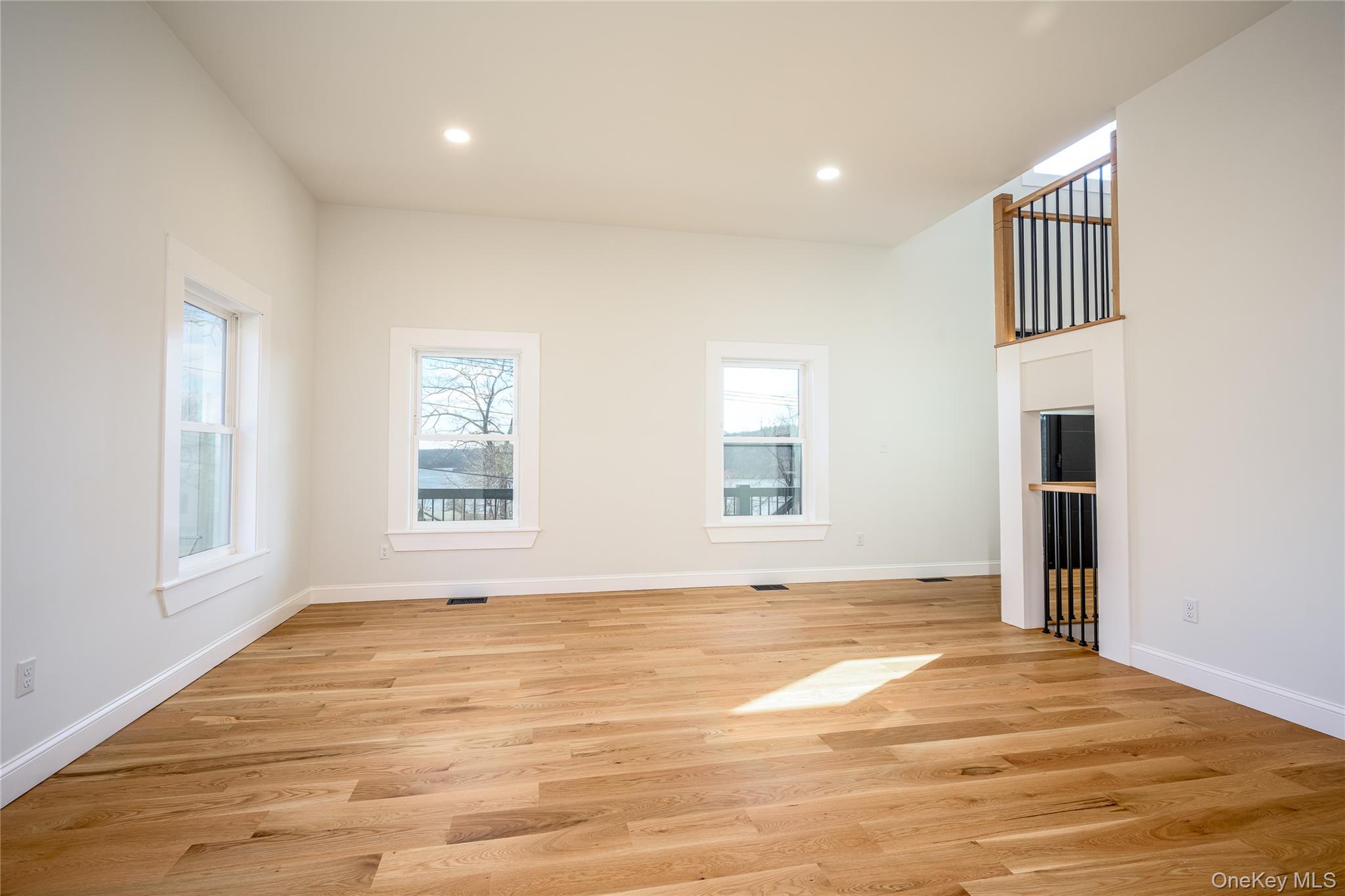 133 West Mombasha Road Monroe, NY 10950 - Photo 19 of 47 a view of an empty room with wooden floor and a window