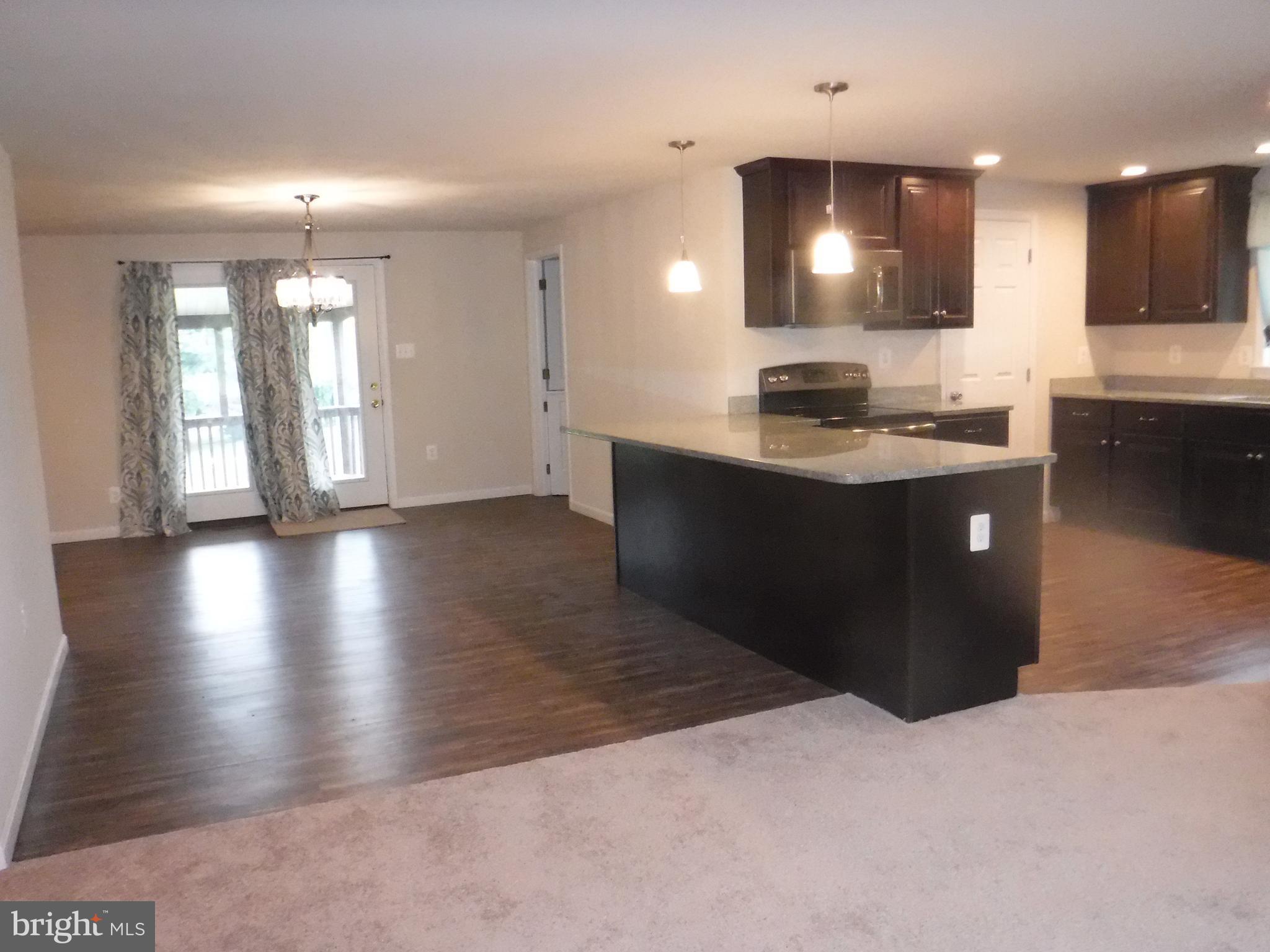 COOKS KITCHEN IS FOCAL POINT OF MAIN LEVEL