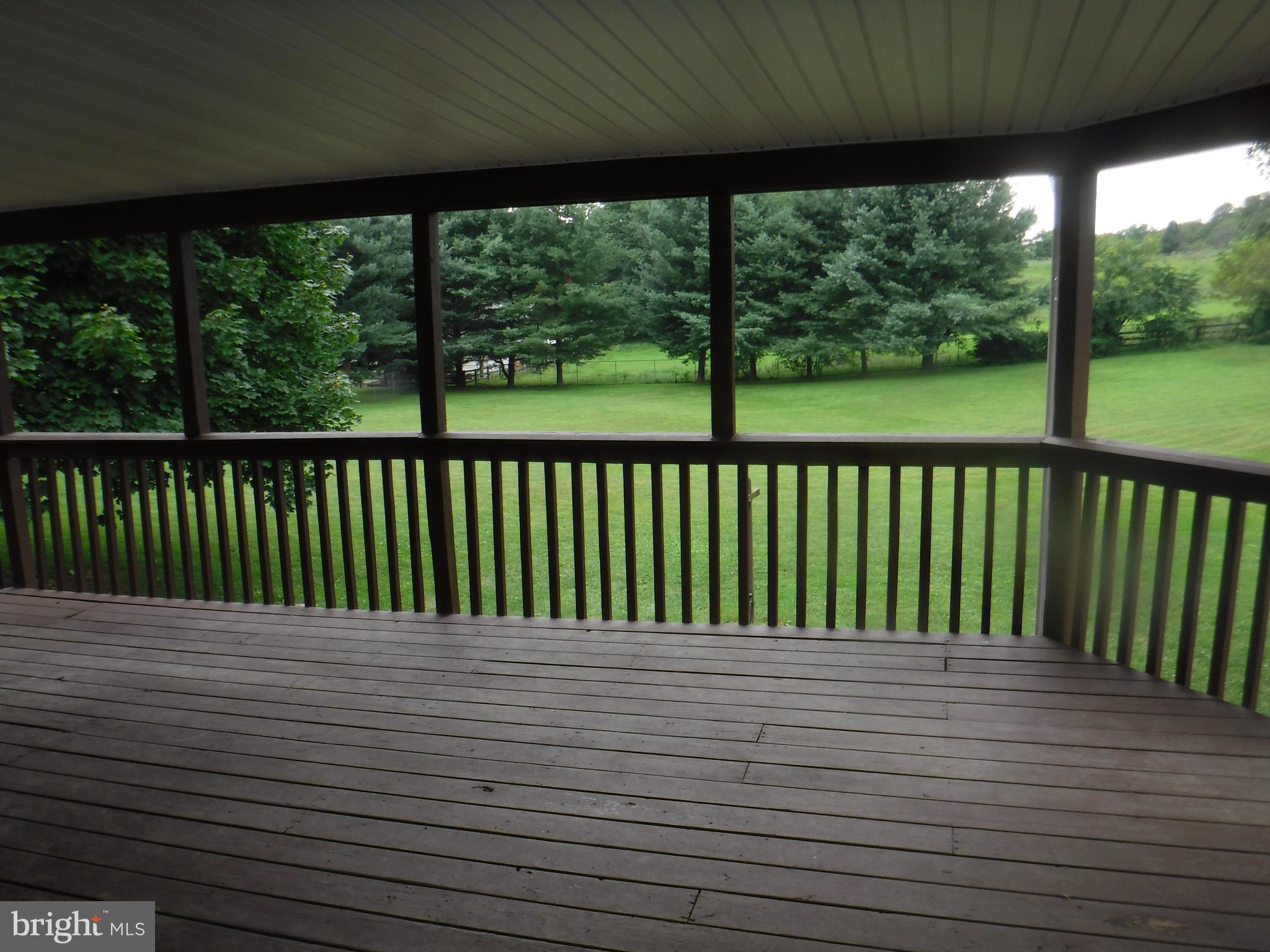 7222 Wheeler Road Boonsboro, MD 21713 - Photo 8 of 27 PORCH OFF DINING ROOM ROCKING, RELAXING ANYONE