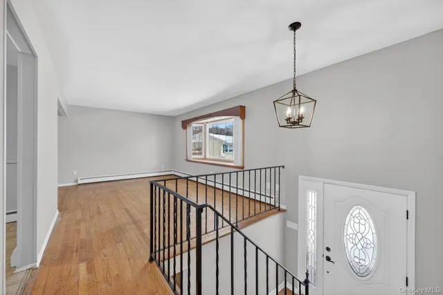a view of a hallway with a window