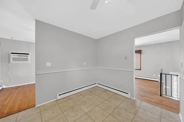 a view of a hallway with chandelier