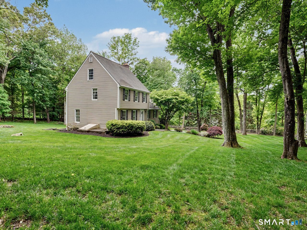 86 Fire Hill Road Redding, CT 06896 - Photo 6 of 36 a view of a house with backyard and garden