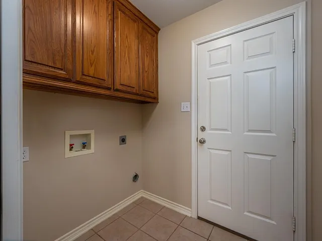 a view of cabinets and wooden door