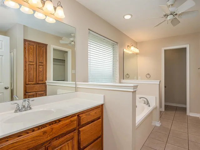 a bathroom with a sink a vanity and a mirror