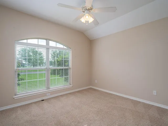 a view of empty room with a window