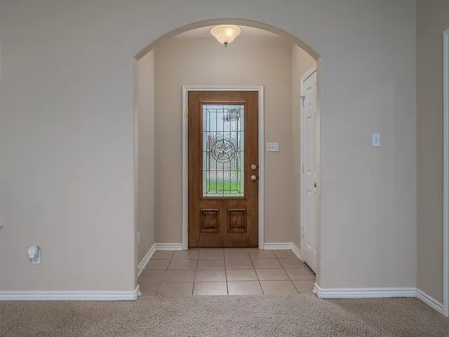 an empty room with mirror