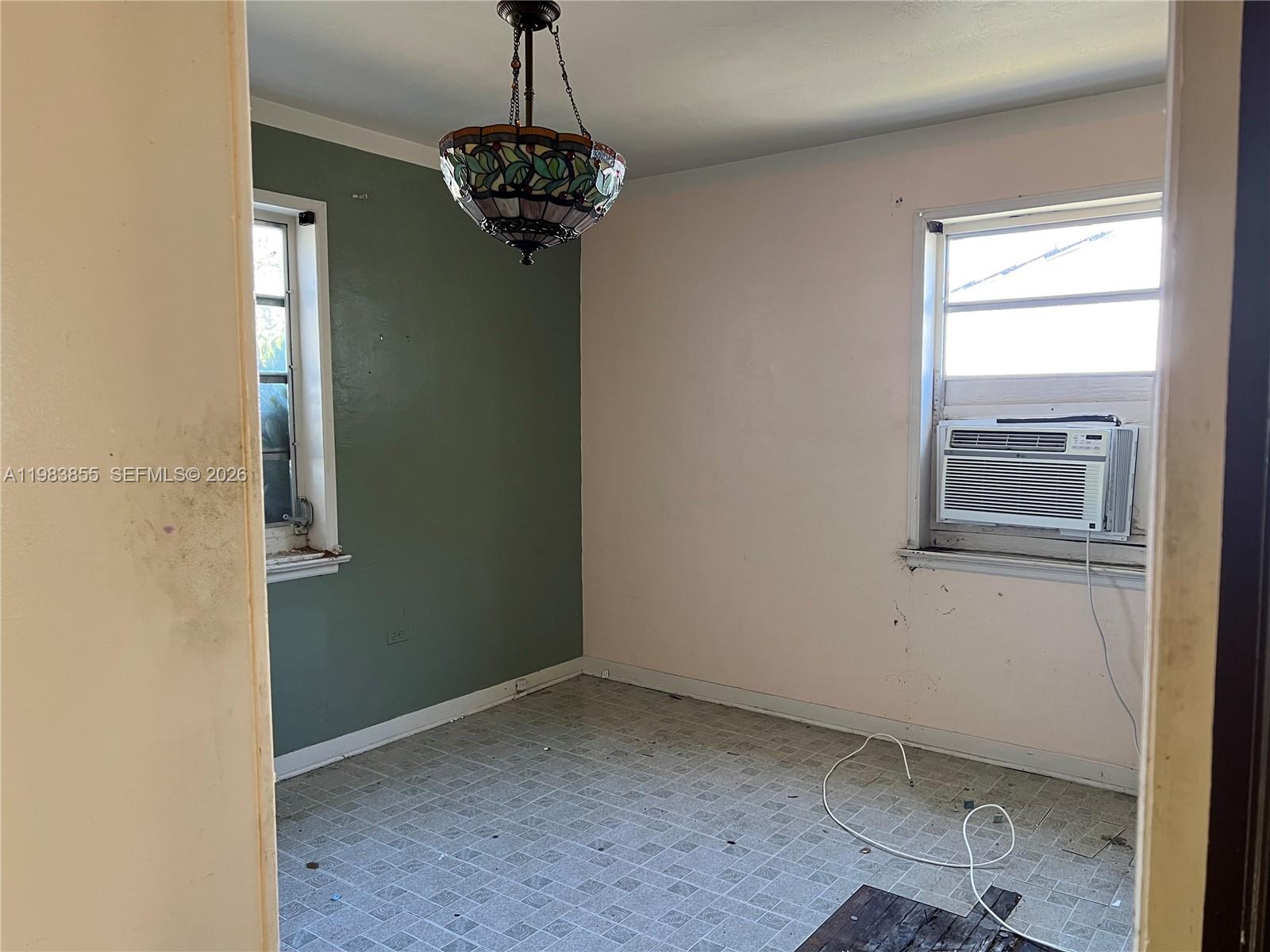 4420 Southwest 3rd Street Miami, FL 33134 - Photo 13 of 44 a room with a window and a chandelier