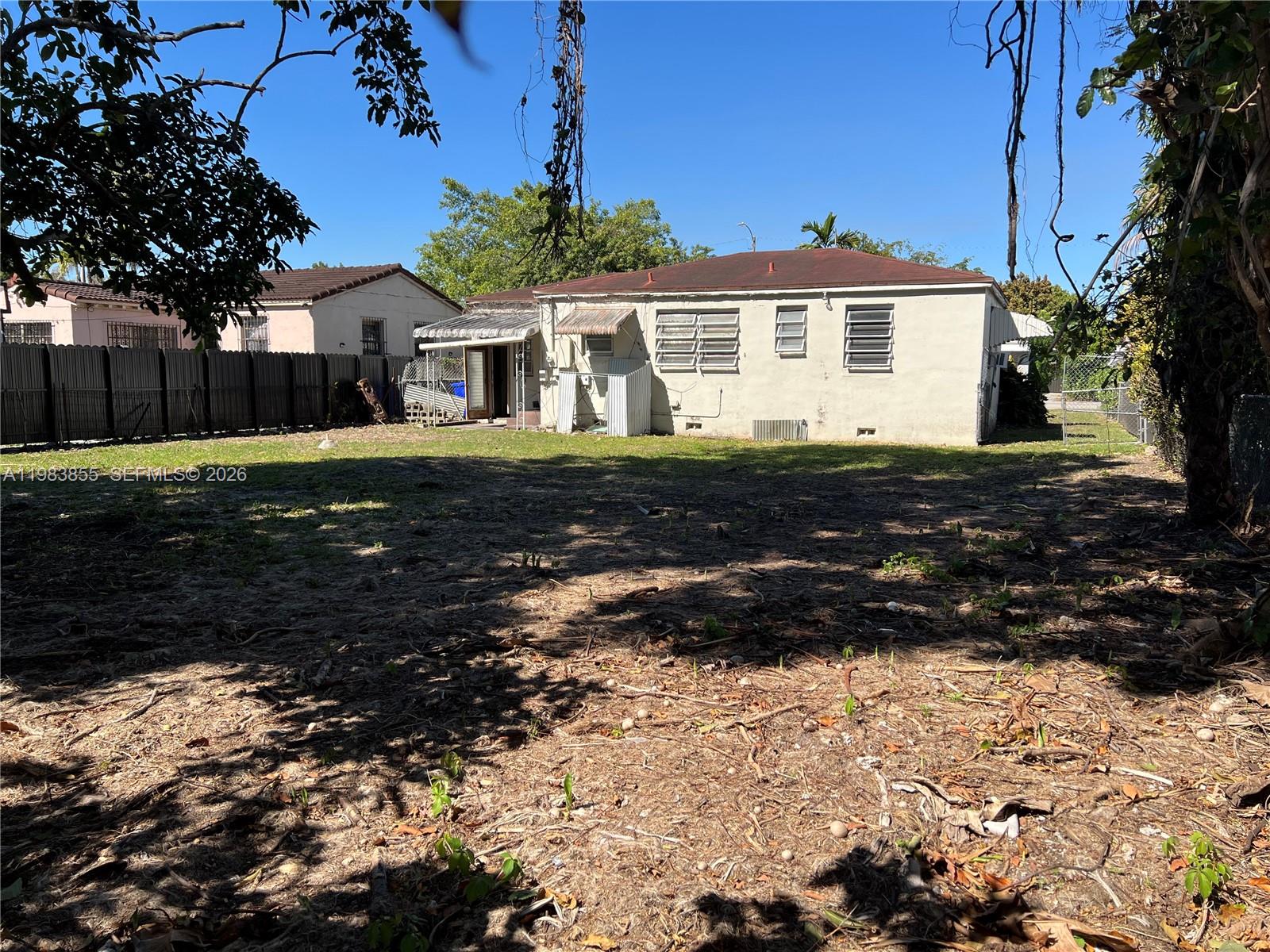 4420 Southwest 3rd Street Miami, FL 33134 - Photo 28 of 44 a front view of a house with a yard