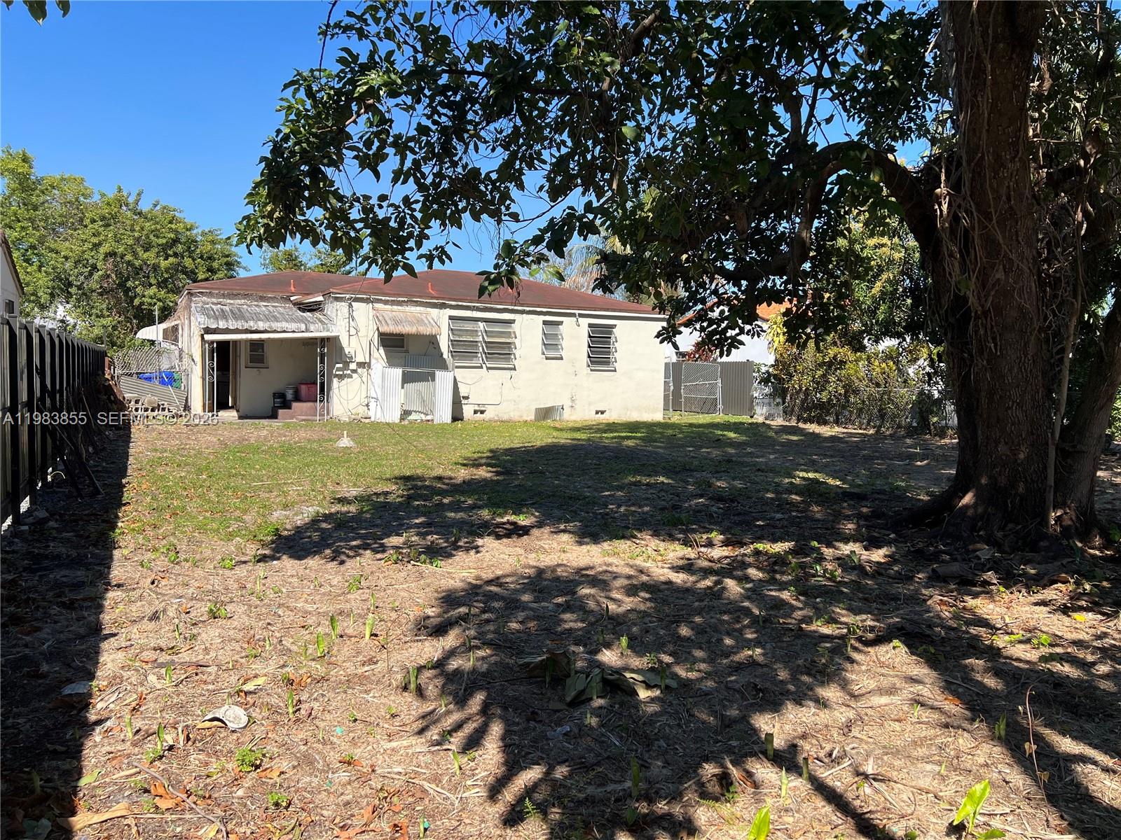 4420 Southwest 3rd Street Miami, FL 33134 - Photo 31 of 44 a front view of a house with a yard