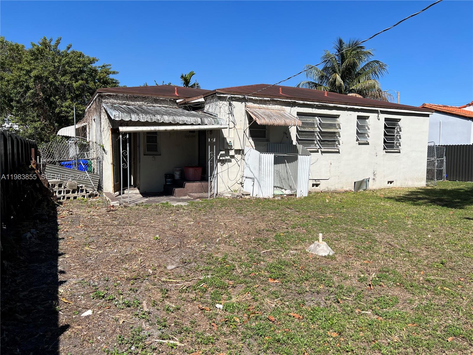 4420 Southwest 3rd Street Miami, FL 33134 - Photo 36 of 44 a front view of a house with a yard