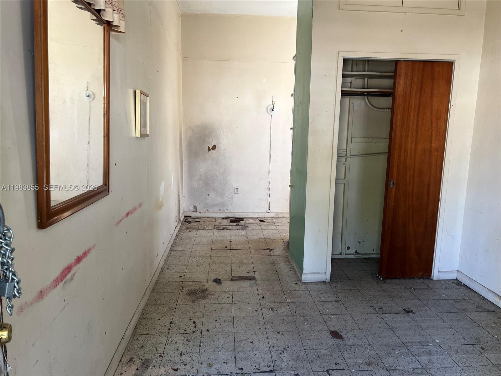4420 Southwest 3rd Street Miami, FL 33134 - Photo 42 of 44 a view of a hallway with wooden floor and a cabinet