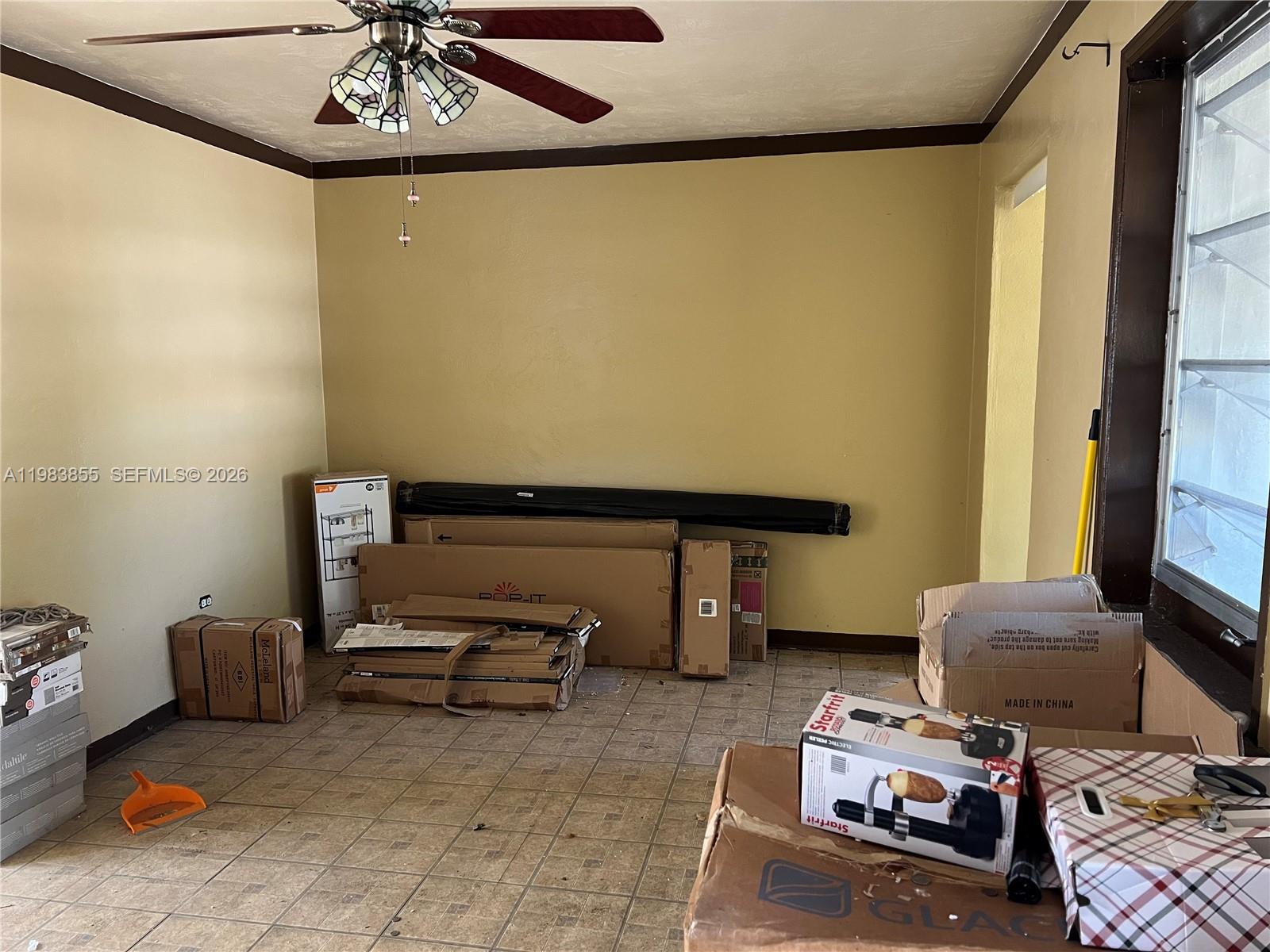 4420 Southwest 3rd Street Miami, FL 33134 - Photo 5 of 44 a living room with furniture and a chandelier