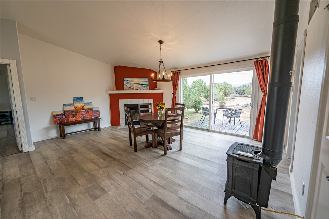 2765 North Silver Springs Road Kingman, AZ 86401 - Photo 41 of 60 a dining room with furniture mountain view and wooden floor