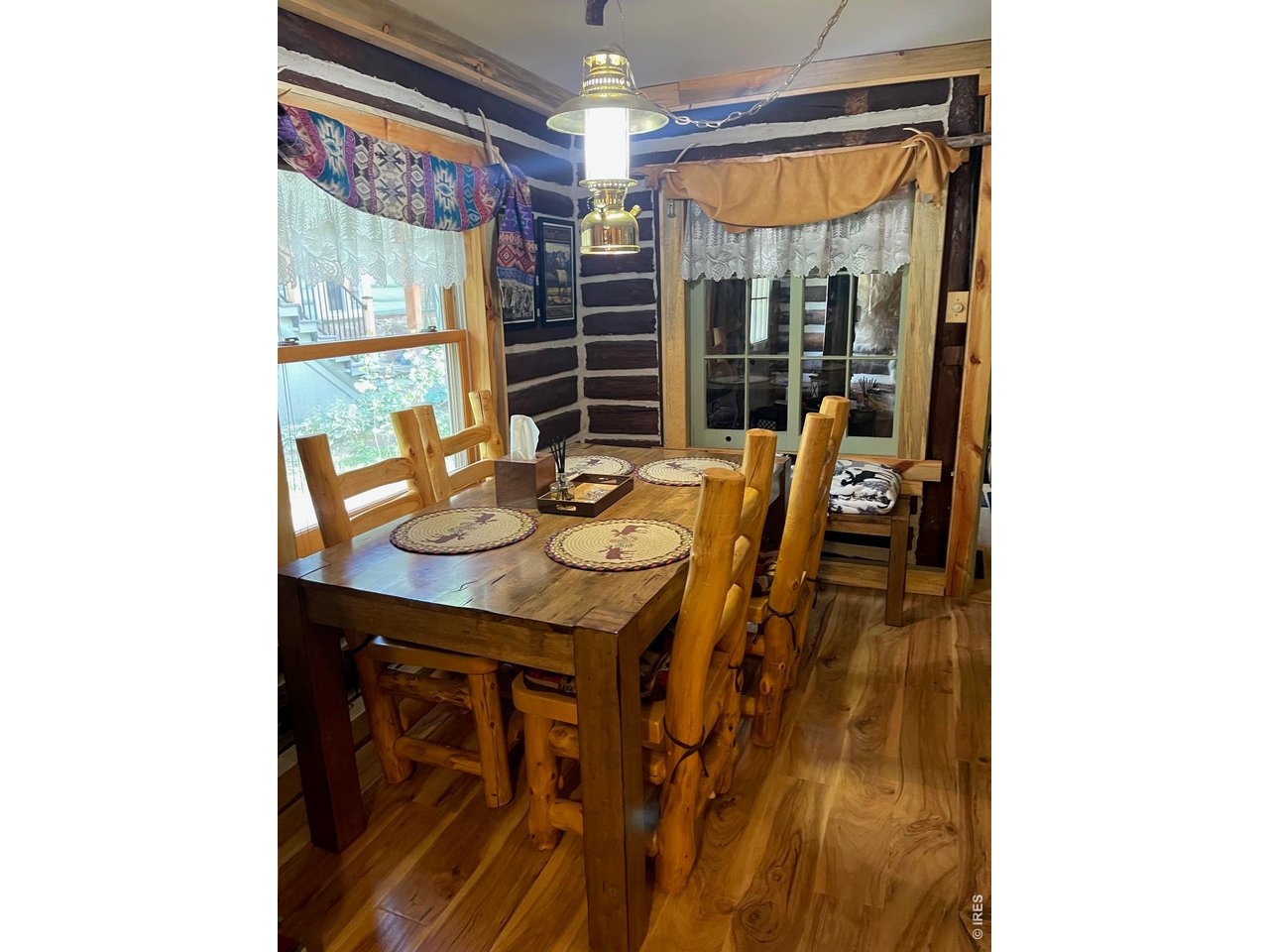 124 Ski Road Allenspark, CO 80510 - Photo 18 of 29 a view of a dining room with furniture and window