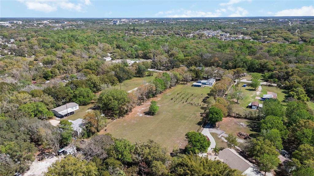 2700 Aein Road Orlando, FL 32817 - Photo 13 of 14 an aerial view of residential house with outdoor space and trees all around
