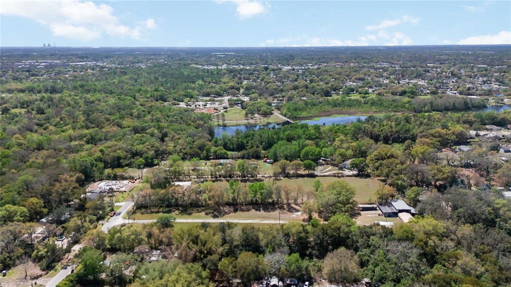2700 Aein Road Orlando, FL 32817 - Photo 5 of 14 an aerial view of residential house with outdoor space and trees around