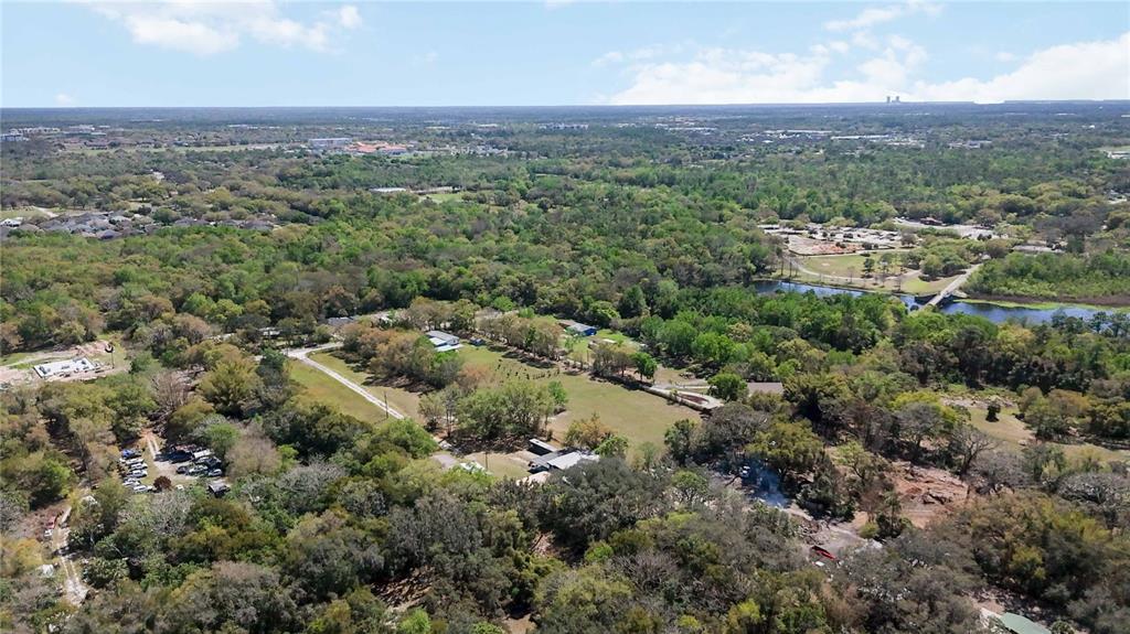 2700 Aein Road Orlando, FL 32817 - Photo 6 of 14 an aerial view of residential houses with outdoor space and trees
