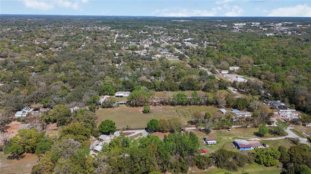 2700 Aein Road Orlando, FL 32817 - Photo 9 of 14 an aerial view of a town with trees