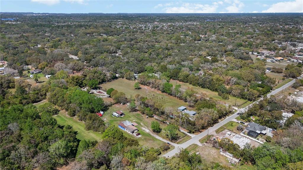 2700 Aein Road Orlando, FL 32817 - Photo 10 of 14 an aerial view of residential houses with outdoor space and trees