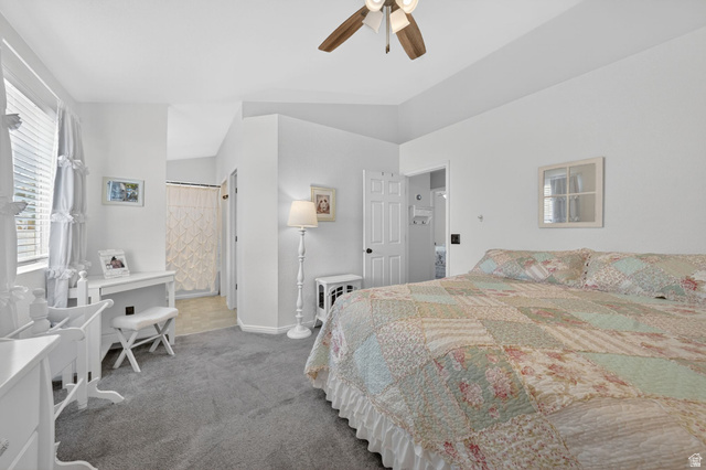 2190 West 1450th Street North Layton, UT 84041 - Photo 10 of 11 Spacious bedroom featuring vaulted ceilings, a ceiling fan with light fixture, gray carpeting, and a window with blinds