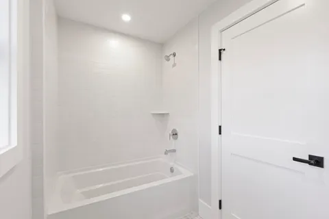 a close view of a bathtub in bathroom