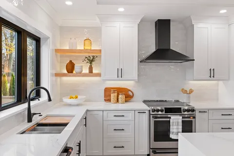a kitchen with a stove a sink and a refrigerator