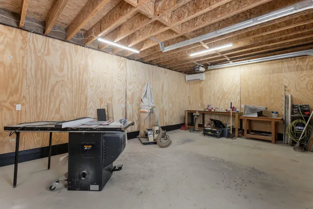 a view of a house with pool and chairs