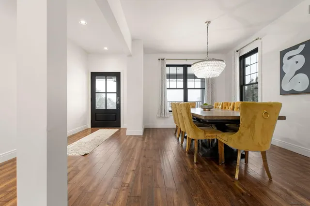 a view of a dining room with furniture window and wooden floor