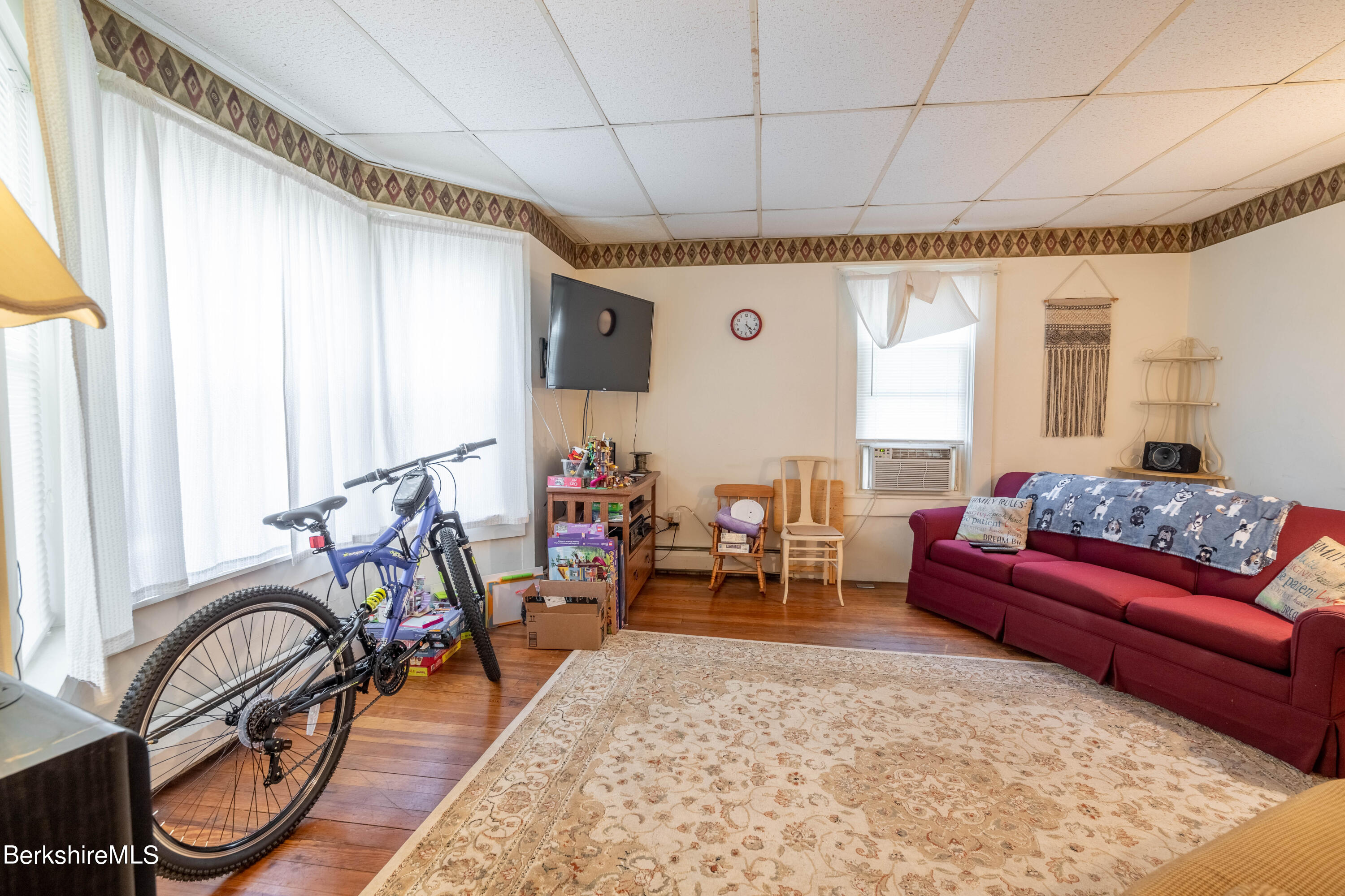 8-10 Gavin Avenue Adams, MA 01220 - Photo 11 of 19 a living room with furniture and a large window