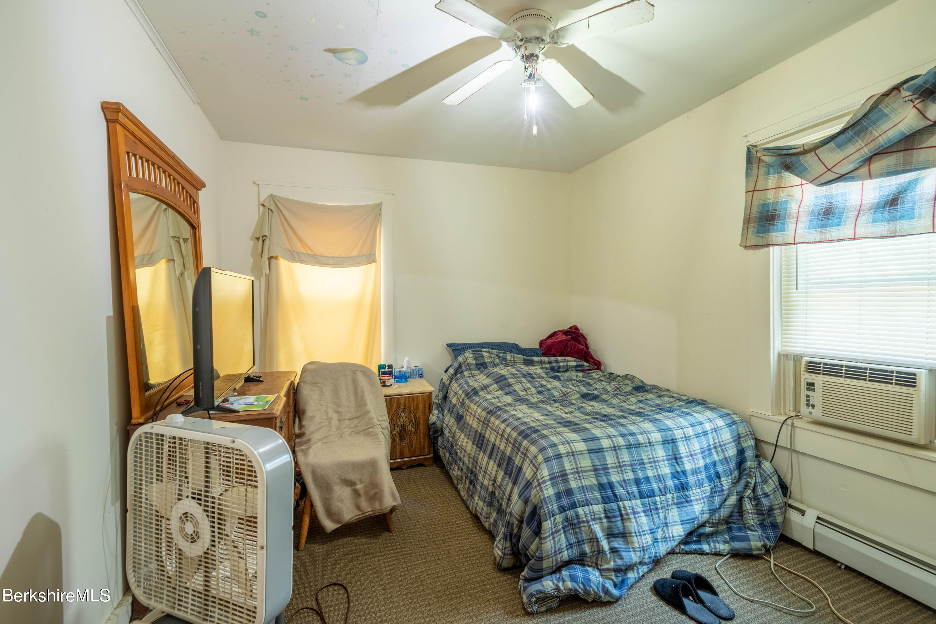 8-10 Gavin Avenue Adams, MA 01220 - Photo 15 of 19 a bedroom with a bed and wooden floor