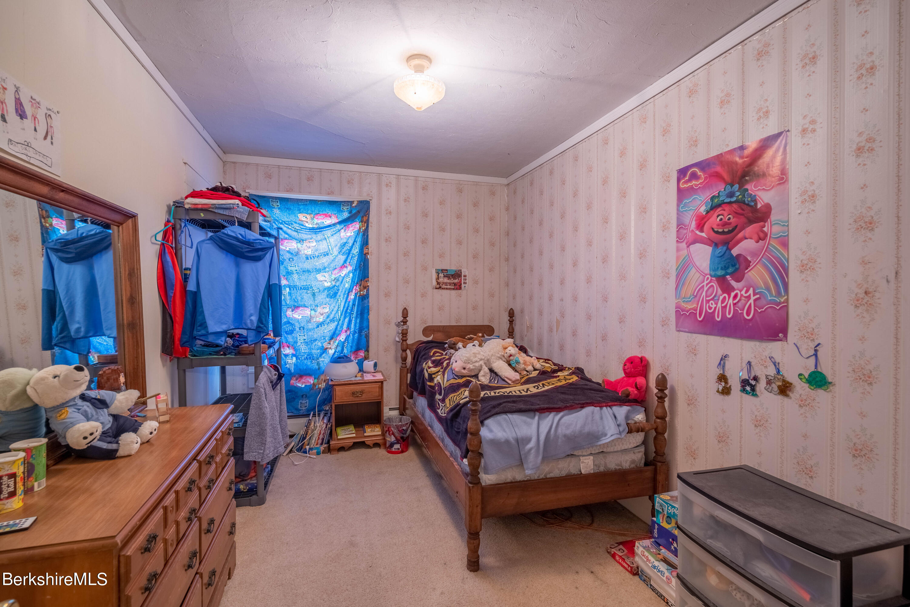 8-10 Gavin Avenue Adams, MA 01220 - Photo 16 of 19 a bedroom with furniture and a chandelier