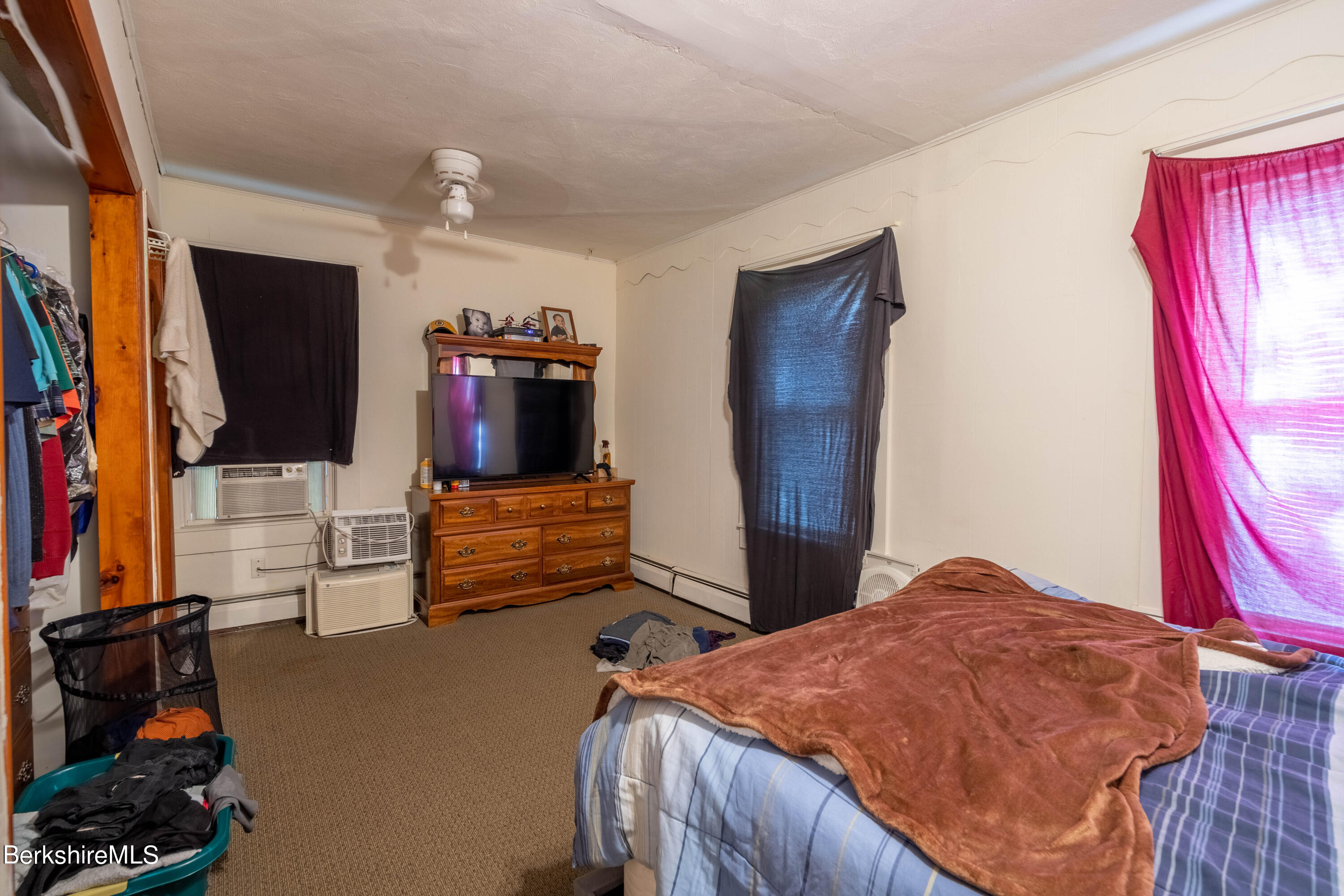 8-10 Gavin Avenue Adams, MA 01220 - Photo 18 of 19 a bedroom with a bed and flat screen tv