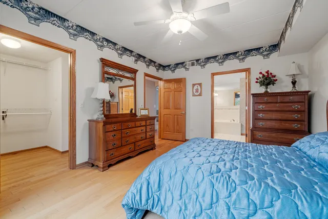 a bedroom with a bed and a dresser