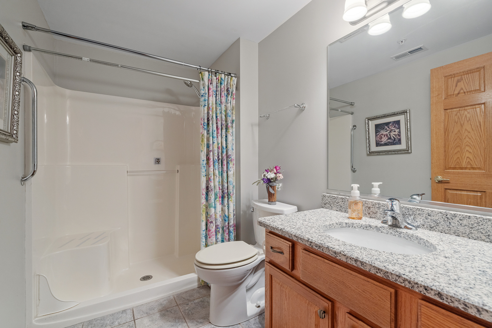 7912 Trinity Circle, Unit 1NW Tinley Park, IL 60487 - Photo 15 of 20 a bathroom with a granite countertop sink toilet and shower