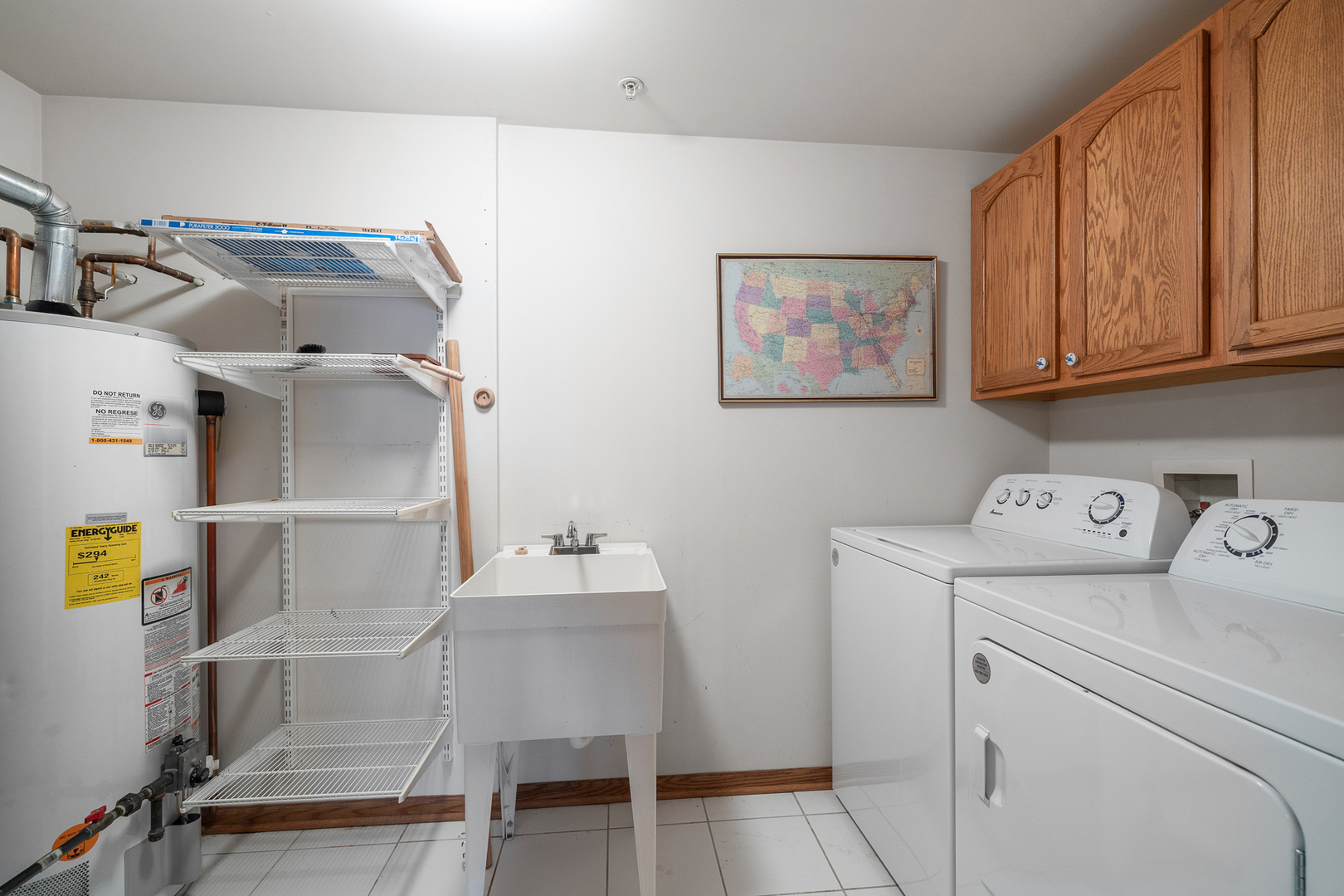 7912 Trinity Circle, Unit 1NW Tinley Park, IL 60487 - Photo 16 of 20 a utility room with dryer and washer