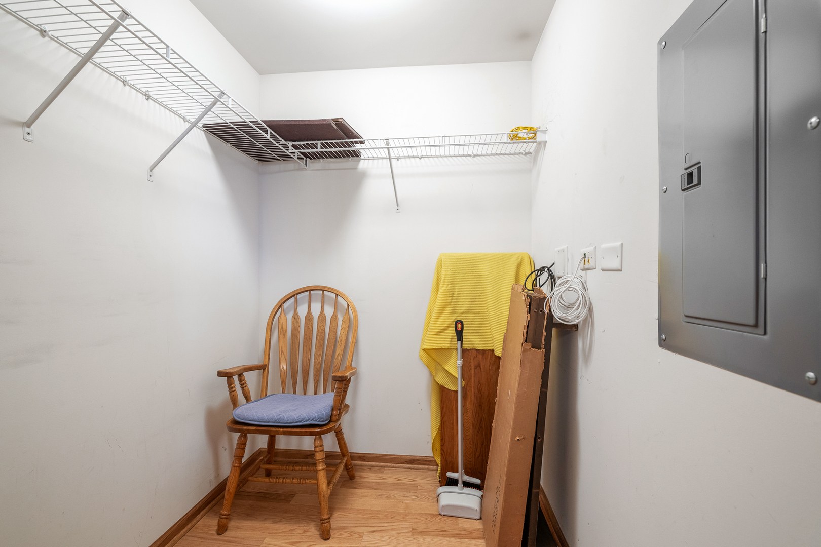 7912 Trinity Circle, Unit 1NW Tinley Park, IL 60487 - Photo 17 of 20 a view of a hallway with wooden chairs