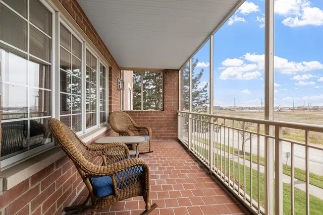 a view of a balcony with chairs